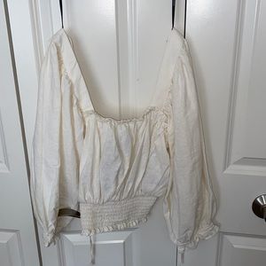 beige top never worn